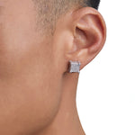 Model wearing white gold diamond earrings by Iceman Society
