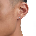 Model wearing white gold moissanite earrings by Iceman Society