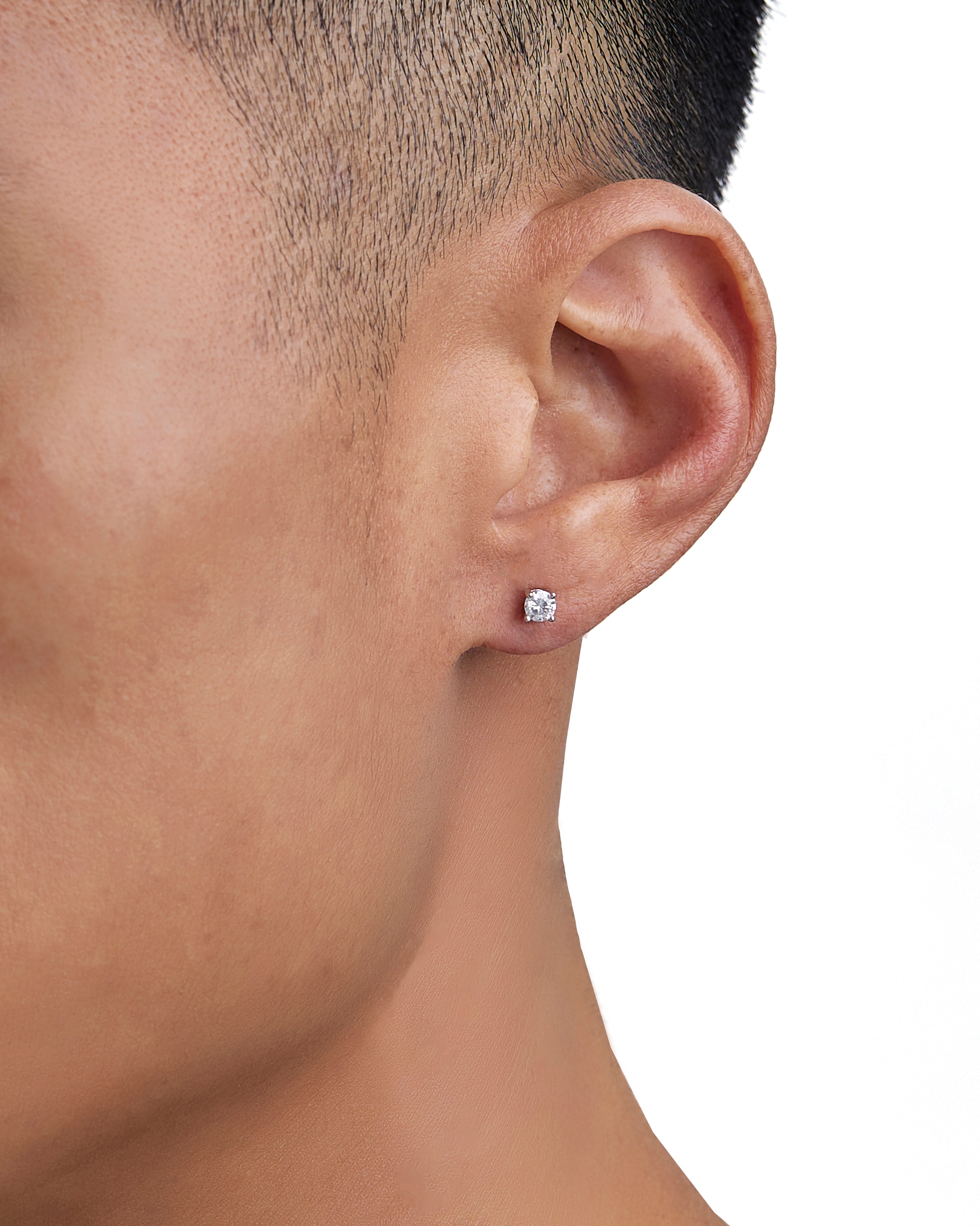 Model wearing white gold moissanite earrings by Iceman Society