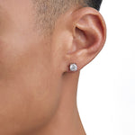 Model wearing white gold moissanite earrings by Iceman Society