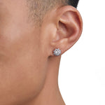 Model wearing white gold moissanite earrings by Iceman Society