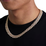 Model wearing 13mm 18K gold ice prong cuban necklace by Iceman Society, side view