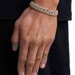 Model wearing 13mm 18K gold ice prong cuban chain set by Iceman Society, side view