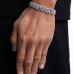 Model wearing 13mm white gold ice prong cuban chain set by Iceman Society, side view