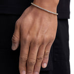 Model wearing 3mm 18k gold tennis bracelet by Iceman Society