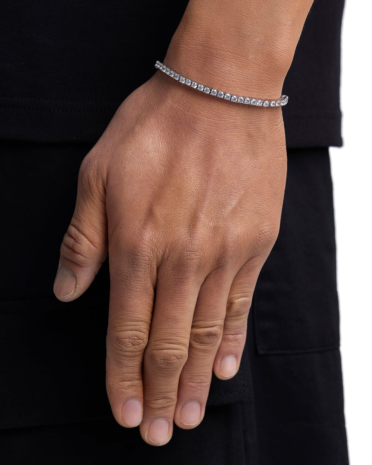 Model wearing 3mm white gold tennis bracelet by Iceman Society
