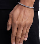 Model wearing 4mm white gold tennis bracelet by Iceman Society