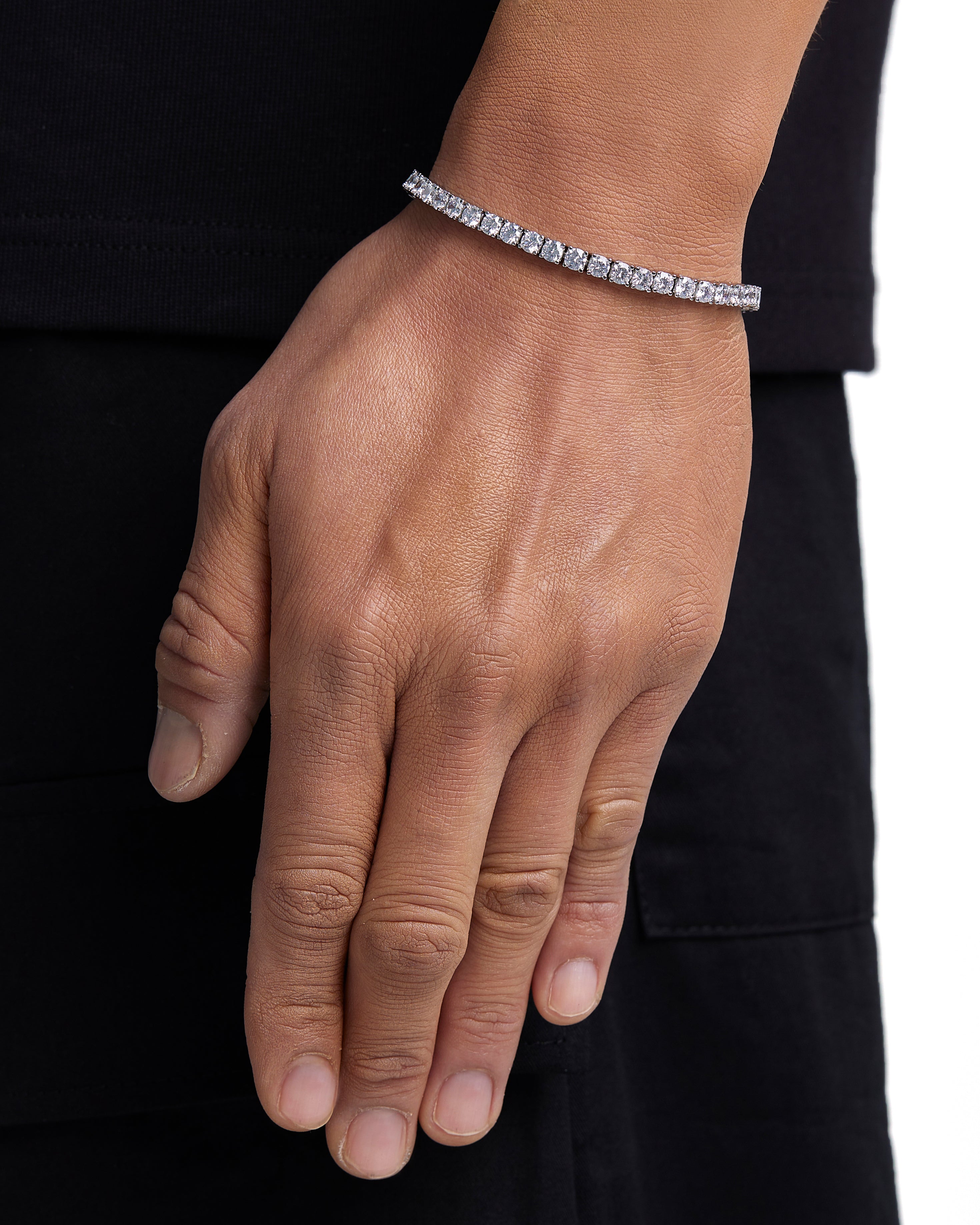 Model wearing 4mm white gold tennis bracelet by Iceman Society