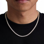 Model wearing 4mm 18k gold tennis necklace by Iceman Society, front view