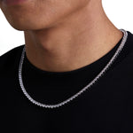 Model wearing 4mm white gold tennis necklace by Iceman Society, side view