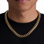 Model wearing 12mm 18k gold plain cuban necklace by Iceman Society