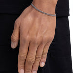 Model wearing 3mm white gold plain cuban bracelet by Iceman Society