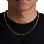 Model wearing 3mm 18k gold plain cuban necklace by Iceman Society