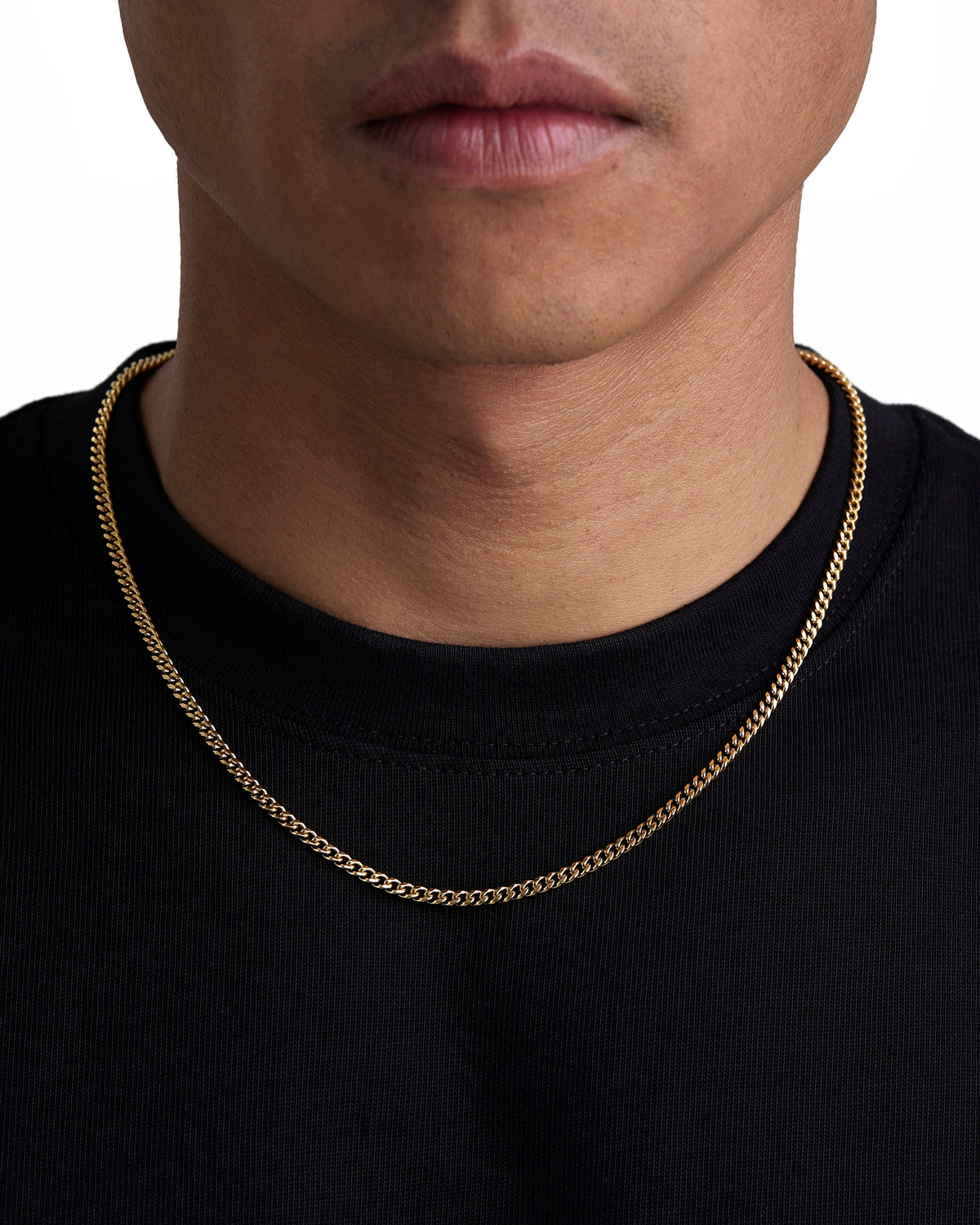 Model wearing 3mm 18k gold plain cuban necklace by Iceman Society