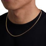 Model wearing 3mm 18k gold plain cuban necklace by Iceman Society, side view
