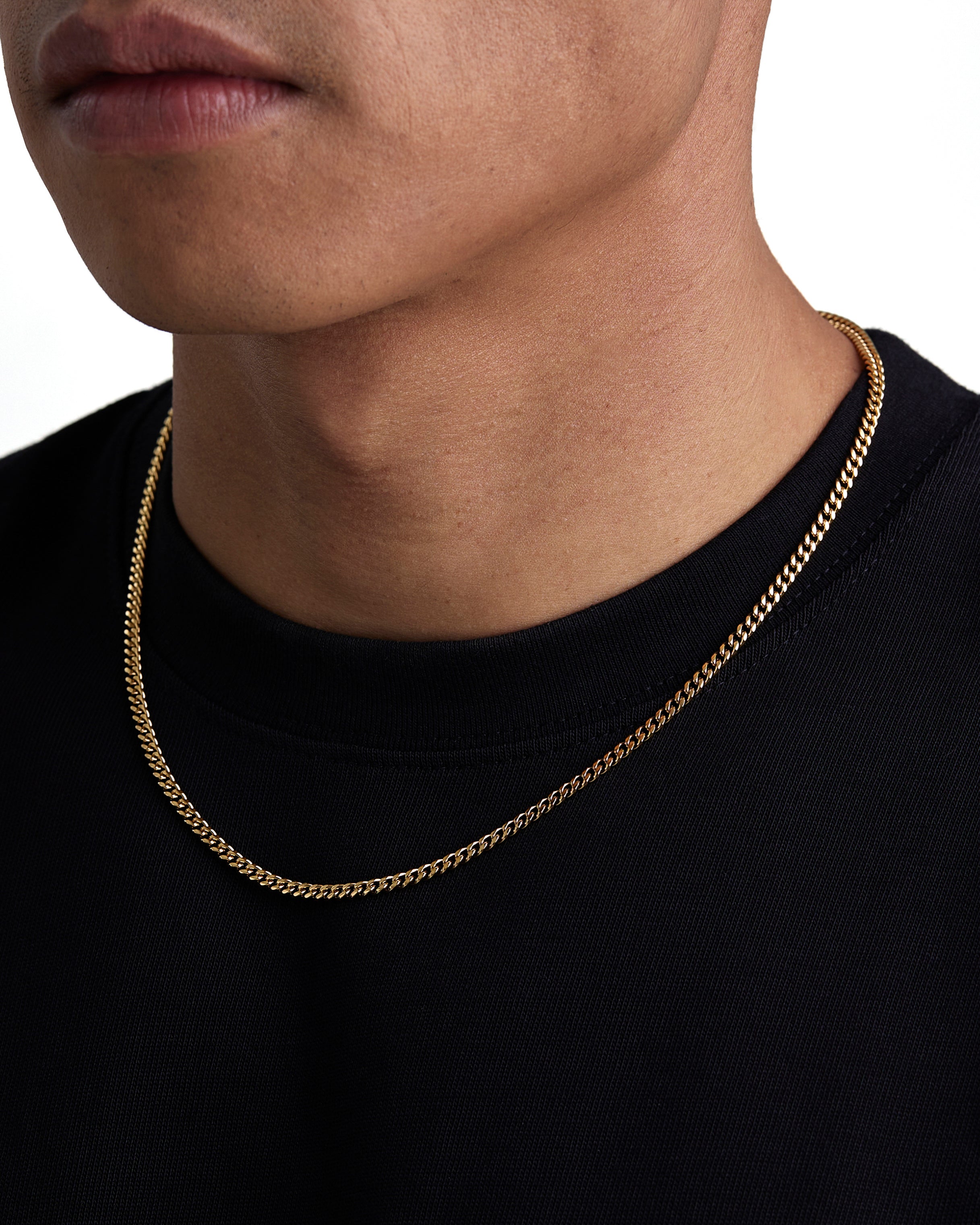 Model wearing 3mm 18k gold plain cuban necklace by Iceman Society, side view