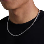 Model wearing 5mm white gold plain cuban necklace by Iceman Society, side view