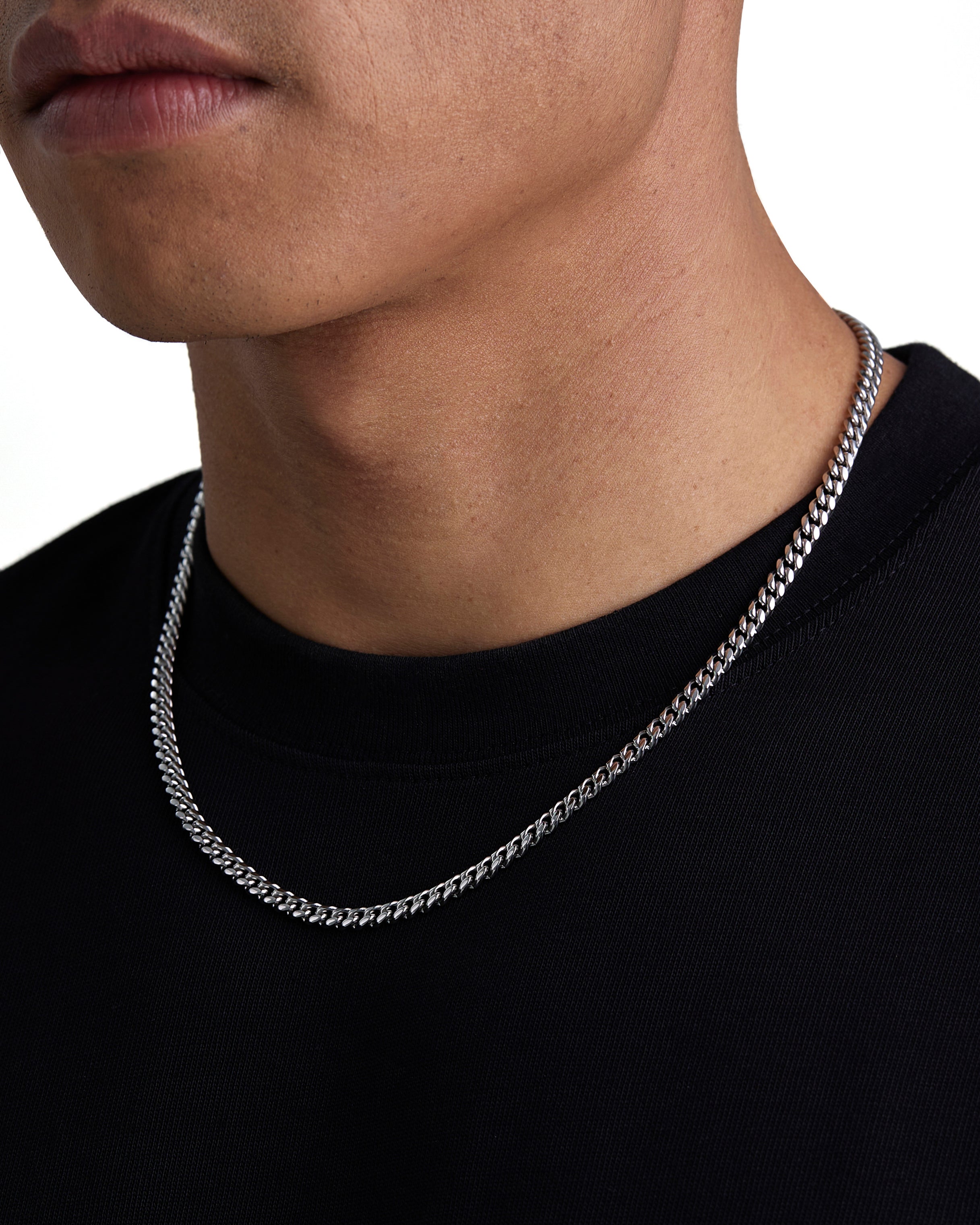 Model wearing 5mm white gold plain cuban necklace by Iceman Society, side view