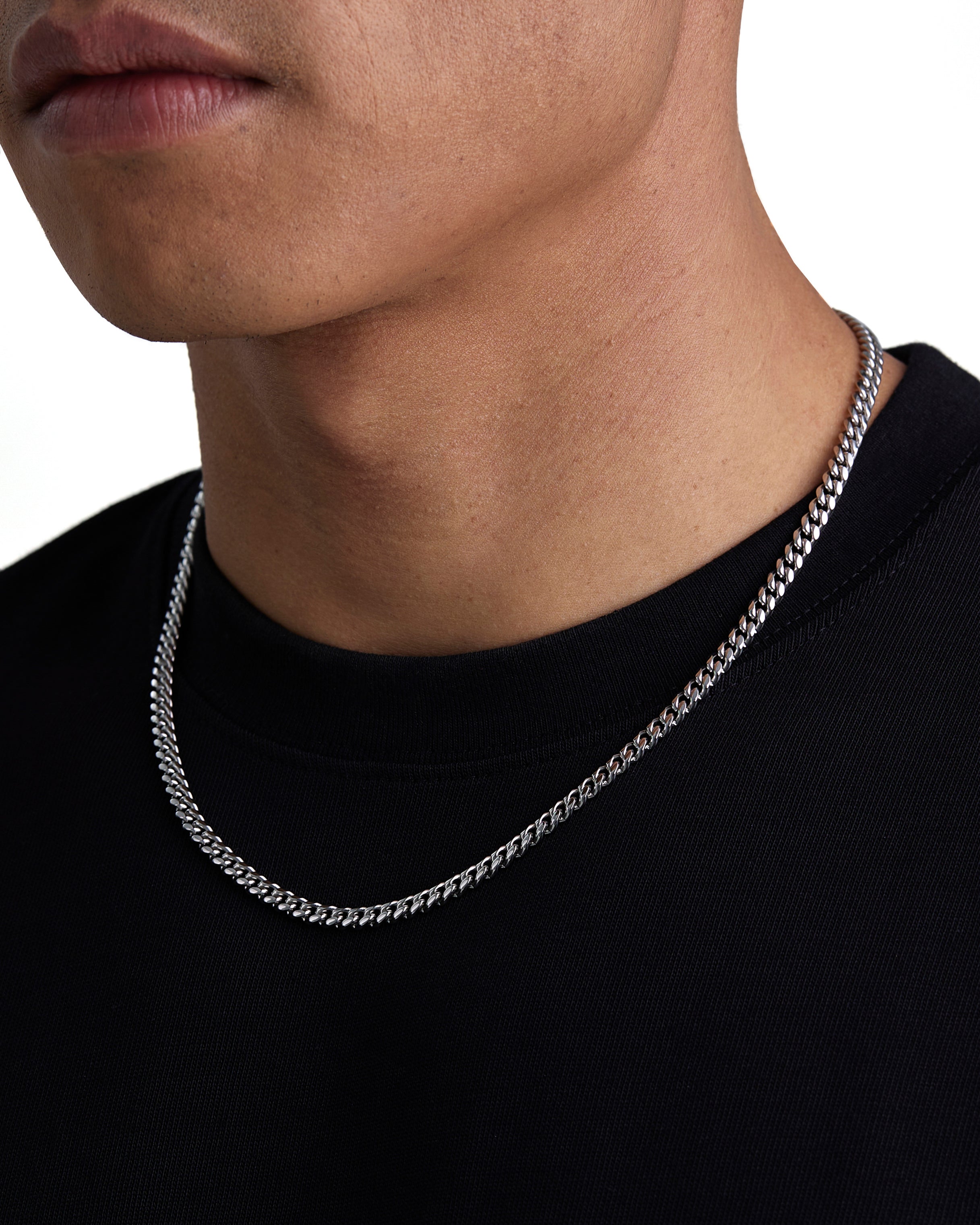 Model wearing 5mm white gold plain cuban necklace by Iceman Society, side view