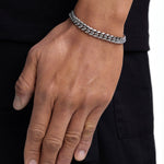 Model wearing 8mm white gold plain cuban bracelet by Iceman Society