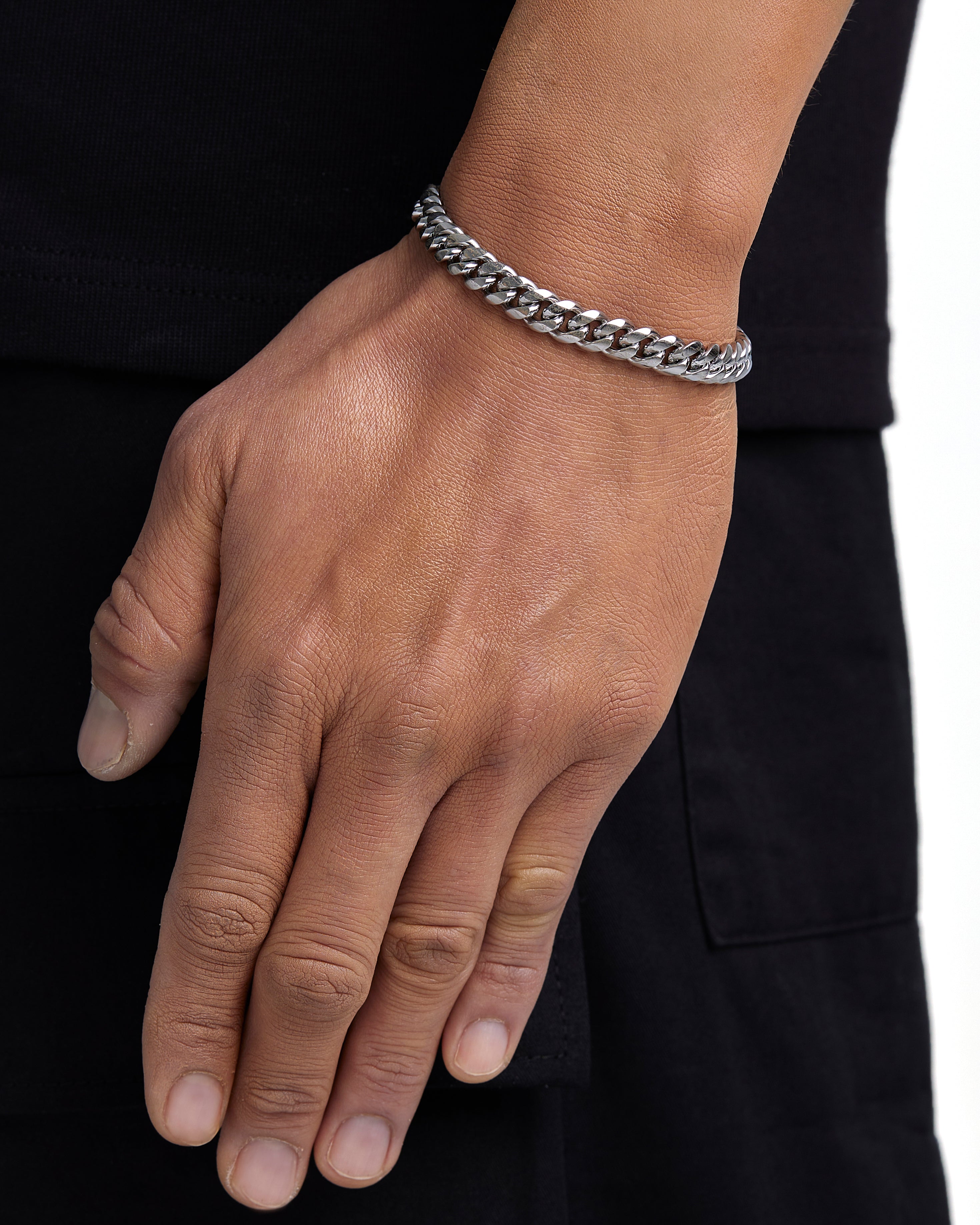 Model wearing 8mm white gold plain cuban bracelet by Iceman Society