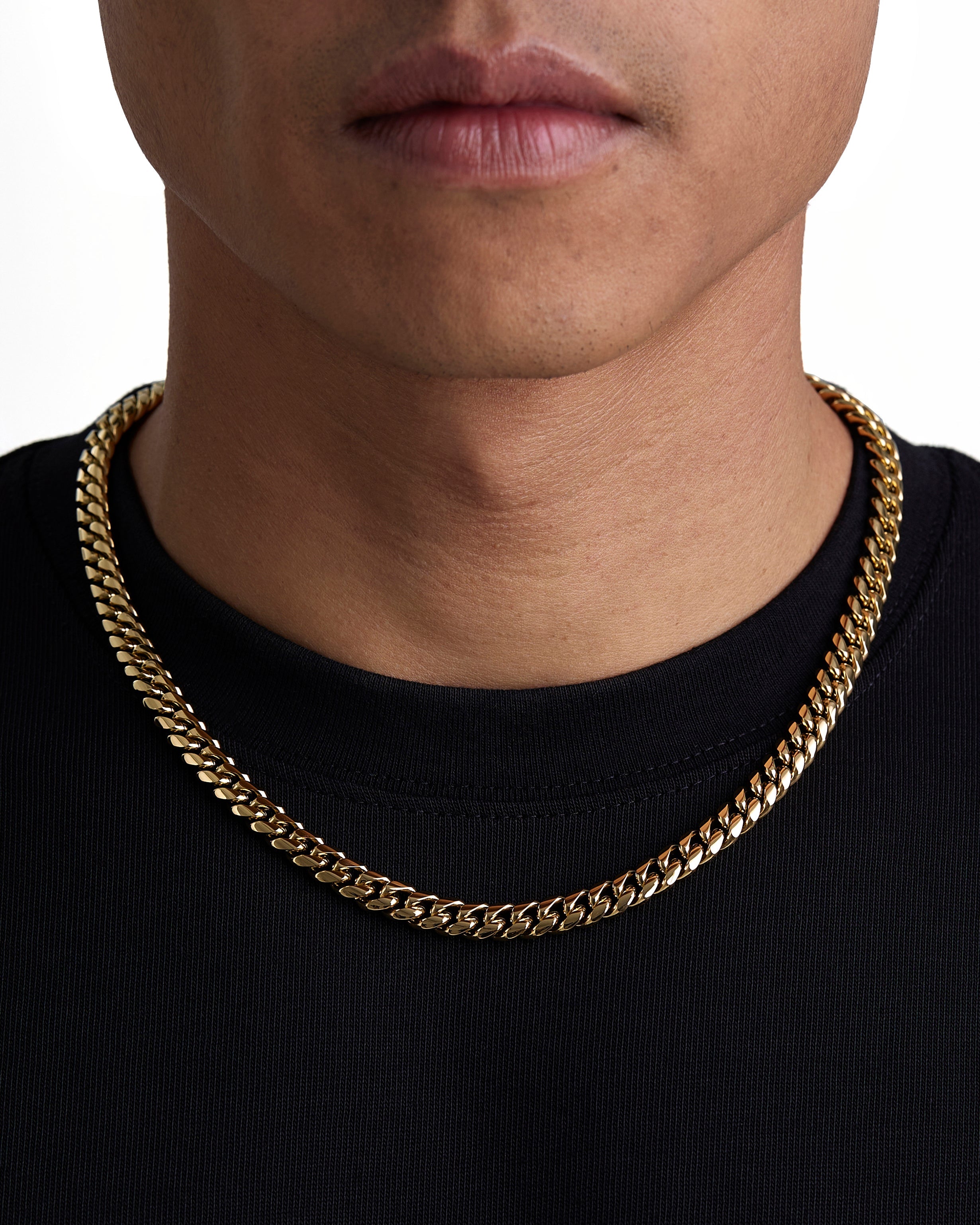 Model wearing 8mm 18k gold plain cuban necklace by Iceman Society