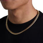 Model wearing 8mm 18k gold plain cuban necklace by Iceman Society, side view