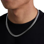 Model wearing 8mm white gold plain cuban necklace by Iceman Society, side view