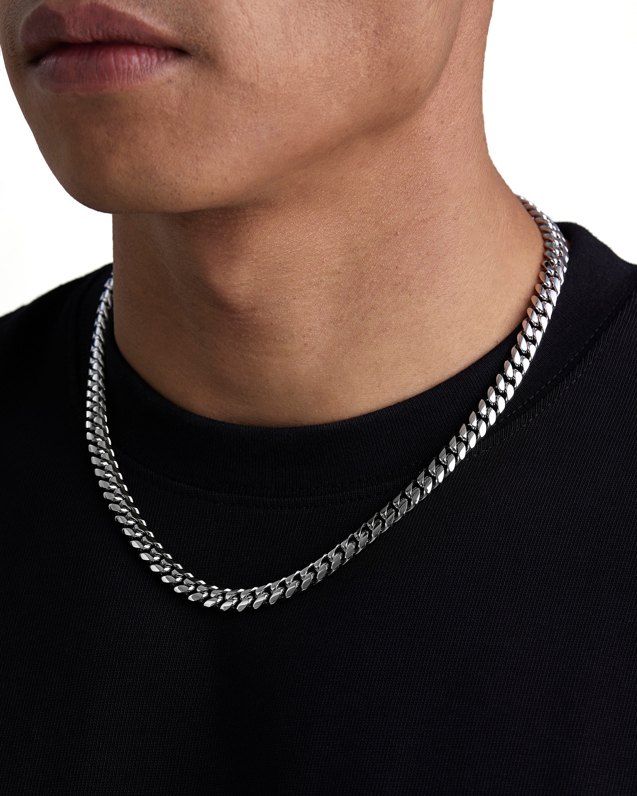 Model wearing 8mm white gold plain cuban necklace by Iceman Society, side view