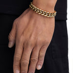 Model wearing 12mm 18K gold plain cuban chain set by Iceman Society, side view