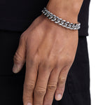 Model wearing 12mm white gold plain cuban chain set by Iceman Society, side view