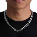 Model wearing 12mm white gold plain cuban chain set by Iceman Society, front view