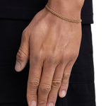 Model wearing 3mm 18K gold plain cuban chain set by Iceman Society, side view