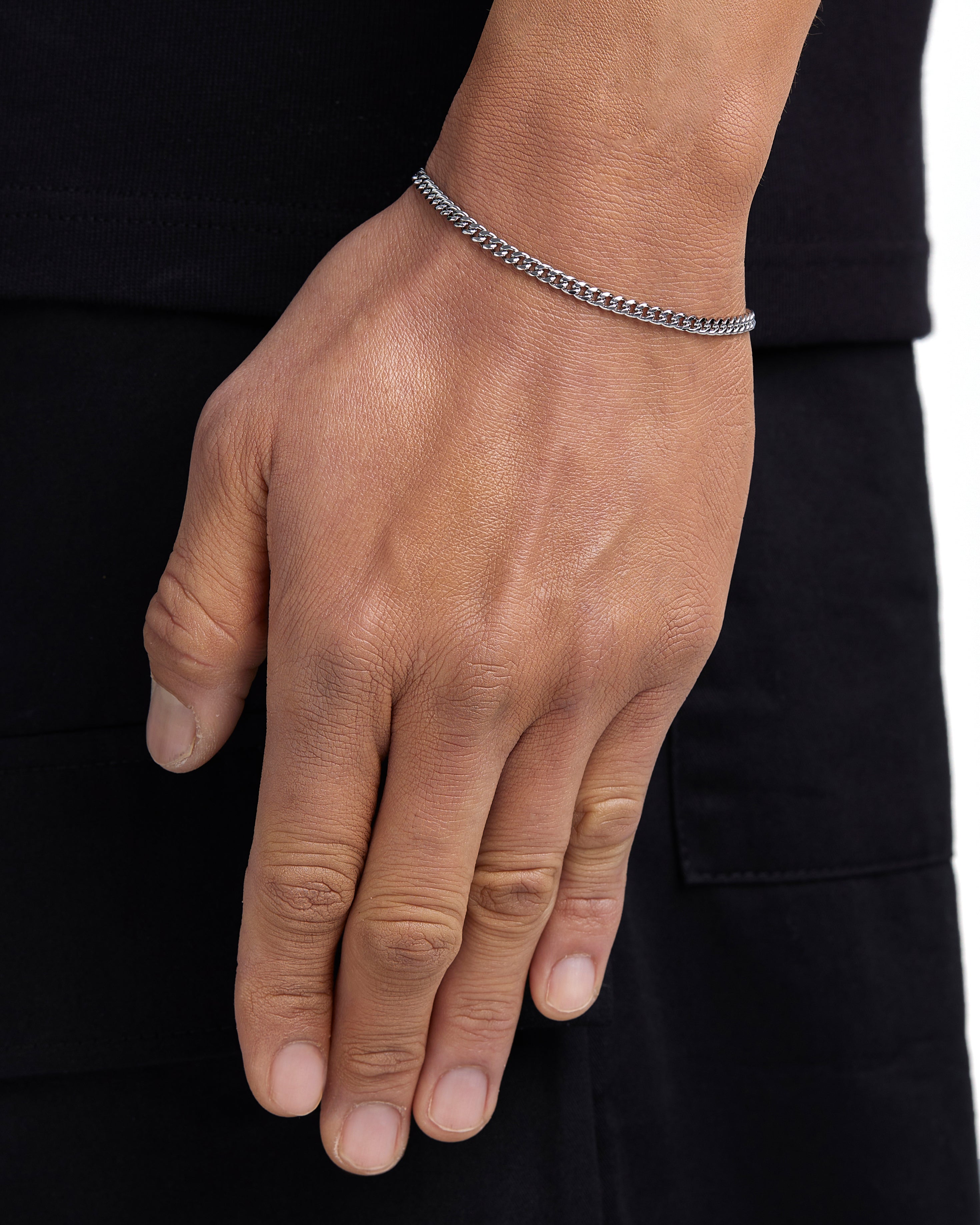 Model wearing 3mm white gold plain cuban chain set by Iceman Society, side view