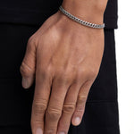 Model wearing 5mm white gold plain cuban chain set by Iceman Society, side view