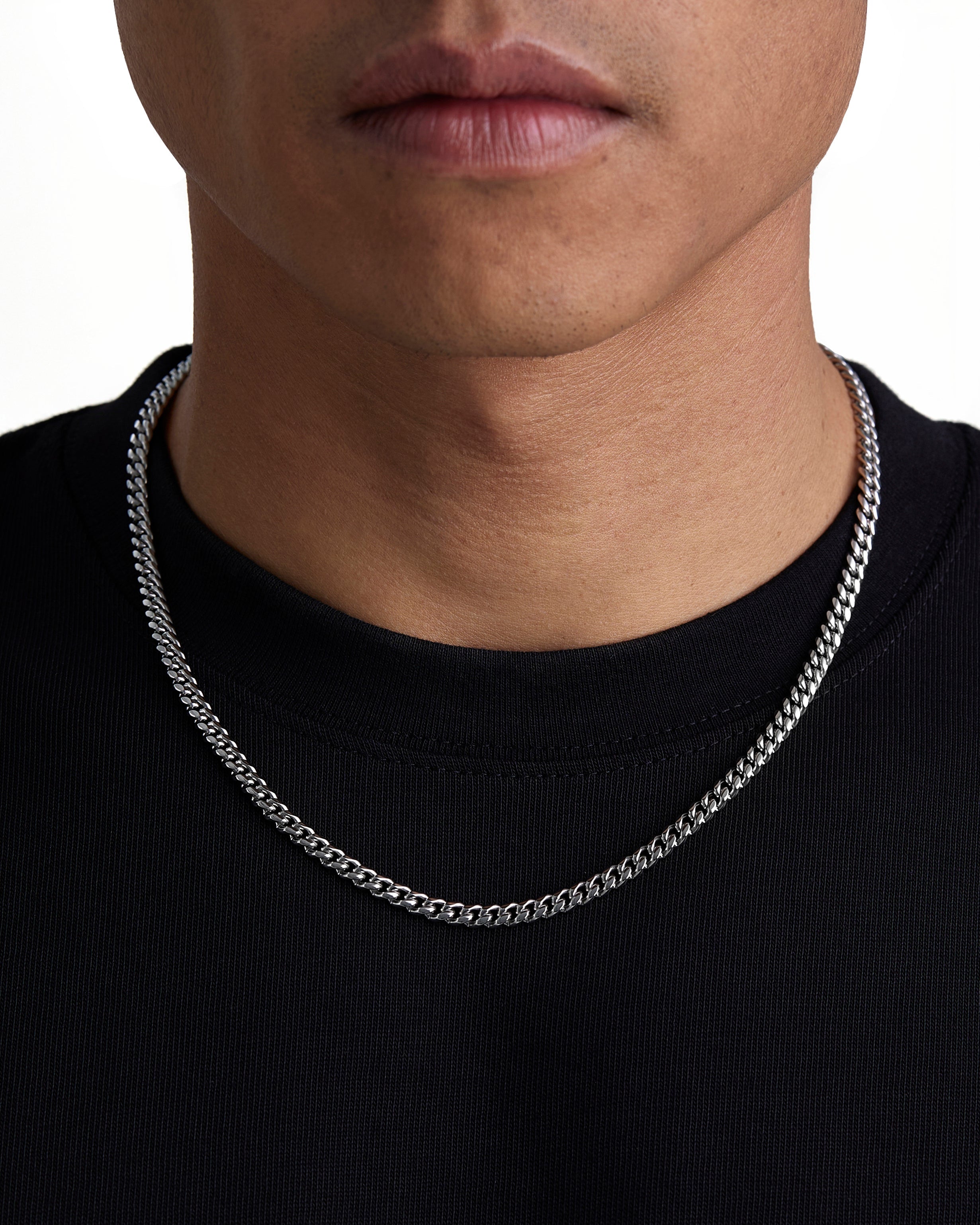 Model wearing 5mm white gold plain cuban chain set by Iceman Society, front view