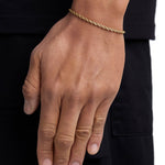 Model wearing 3mm 18k gold rope bracelet by Iceman Society