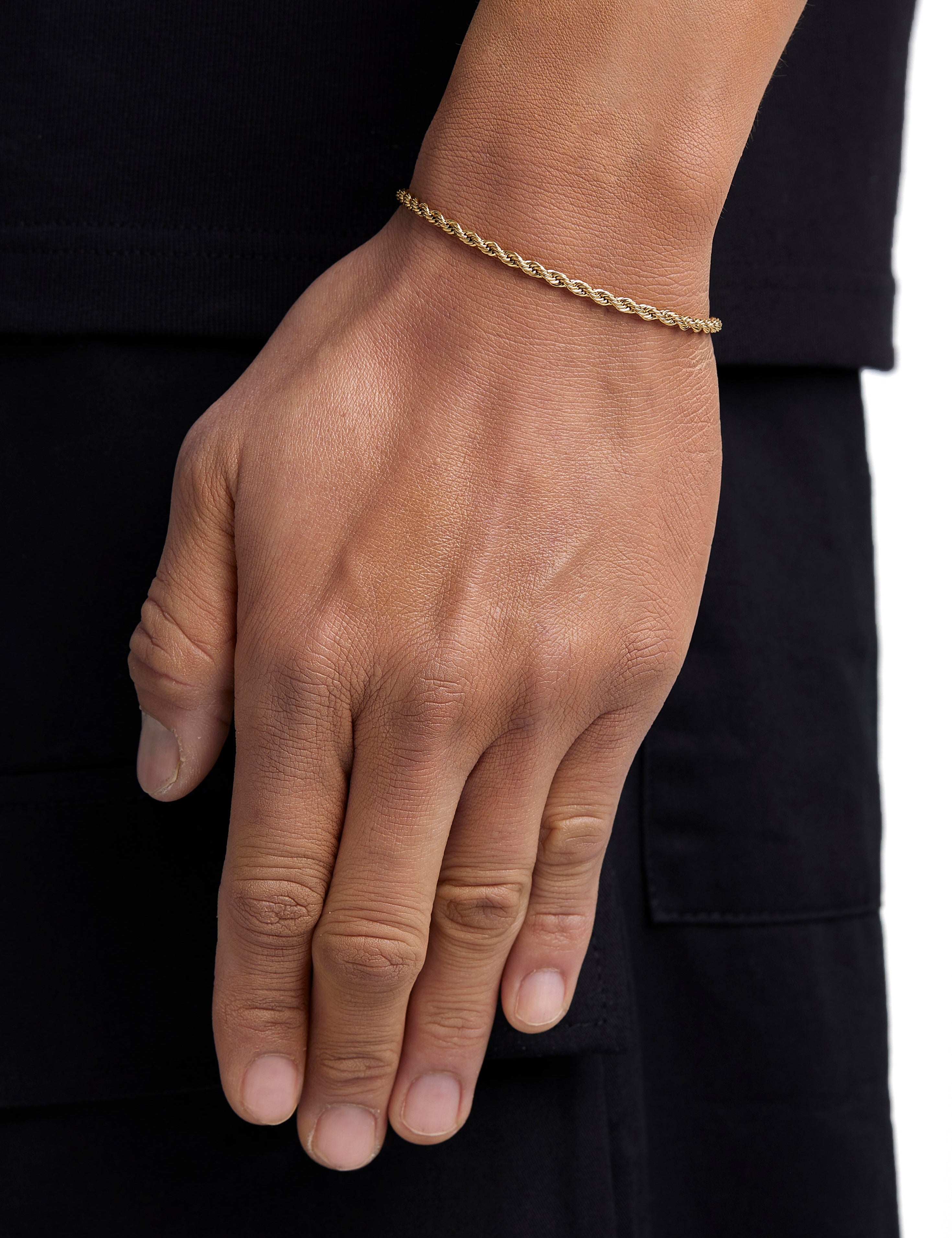 Model wearing 3mm 18k gold rope bracelet by Iceman Society