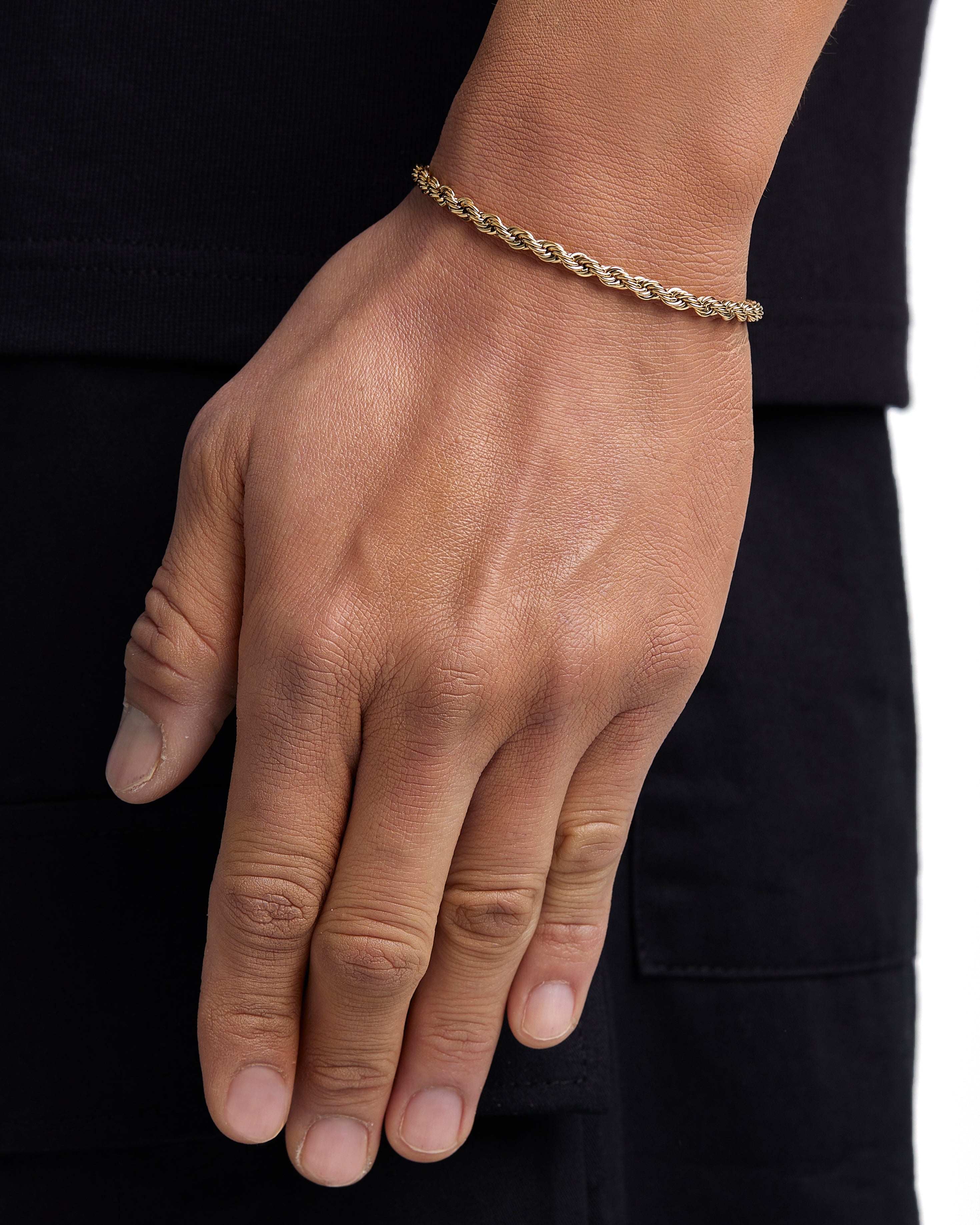 Model wearing 4mm 18k gold rope bracelet by Iceman Society