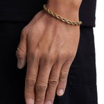 Model wearing 6mm 18k gold rope bracelet by Iceman Society