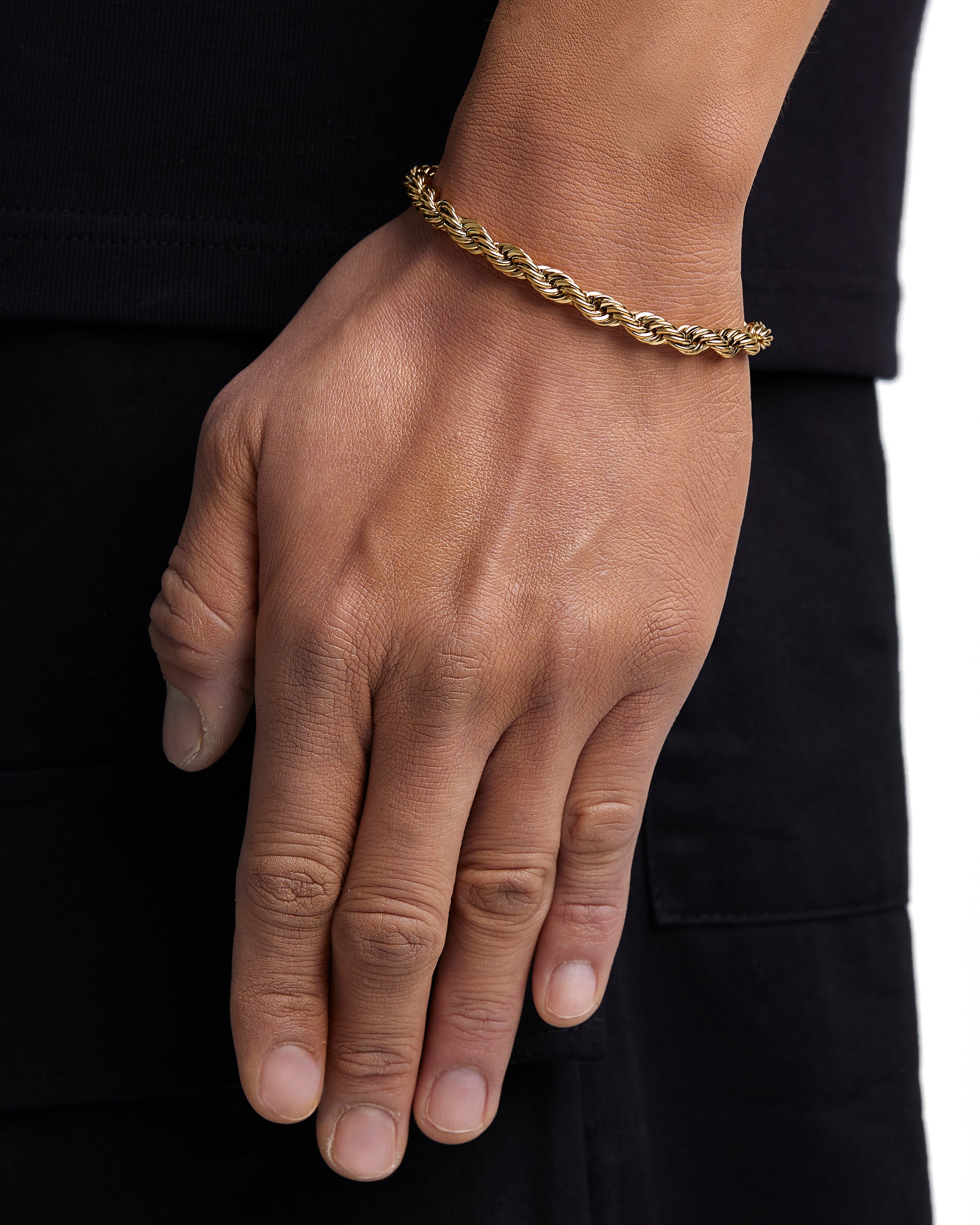 Model wearing 6mm 18k gold rope bracelet by Iceman Society