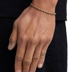 Model wearing 4mm 18k gold rope chain set by Iceman Society, side view