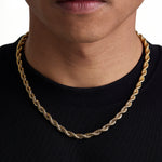 Model wearing 6mm 18k gold rope chain set by Iceman Society, front view