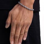 Model wearing 6mm white gold rope chain set by Iceman Society, side view